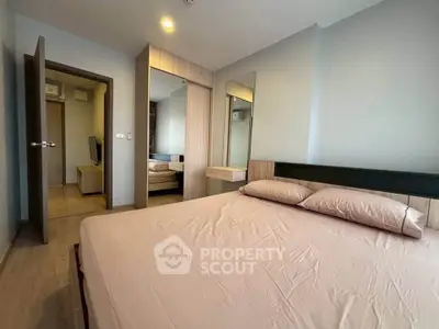 Modern bedroom with stylish decor and ample natural light
