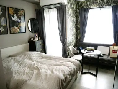 Cozy bedroom with stylish decor and natural light