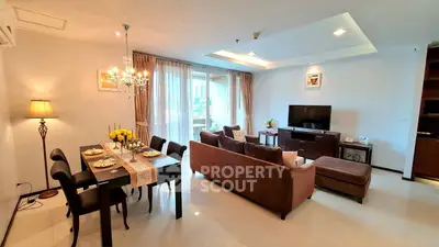 Spacious living room with elegant dining area and modern decor in a luxurious apartment.