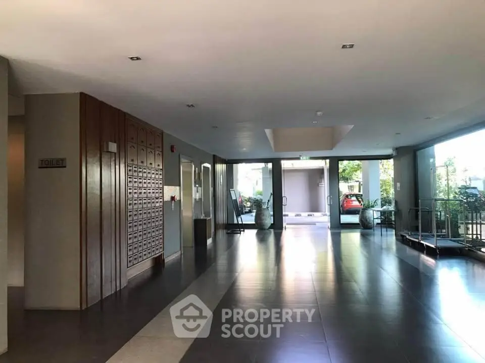 Spacious modern building entrance with sleek design and natural lighting