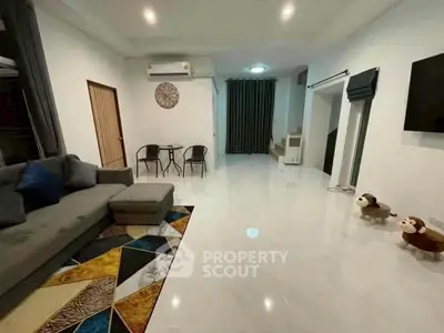 Spacious modern living room with stylish decor and comfortable seating