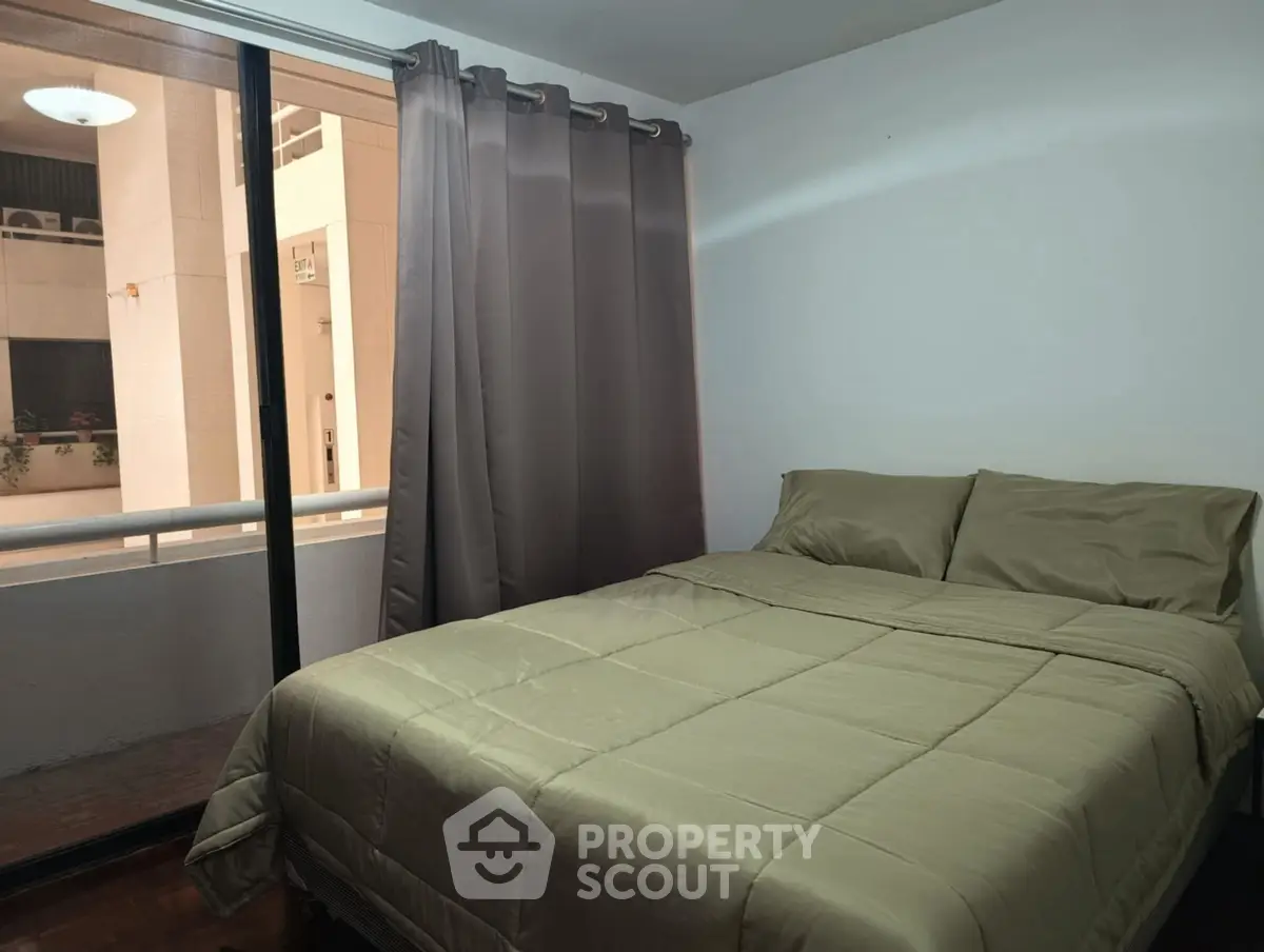 Cozy bedroom with balcony view in modern apartment