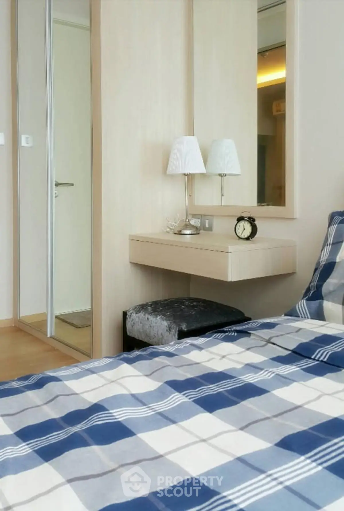 Cozy bedroom with plaid bedding and elegant decor