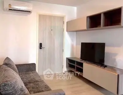 Modern living room with sleek furniture and wall-mounted TV, perfect for cozy relaxation.