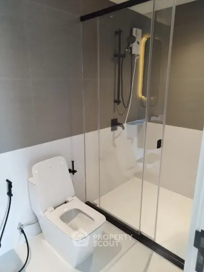 Modern bathroom with sleek shower and toilet design