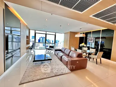 Luxurious modern living room with stunning city view and elegant furnishings.
