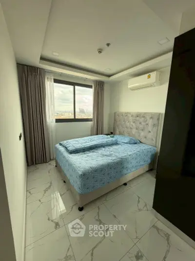 Modern bedroom with city view and elegant decor