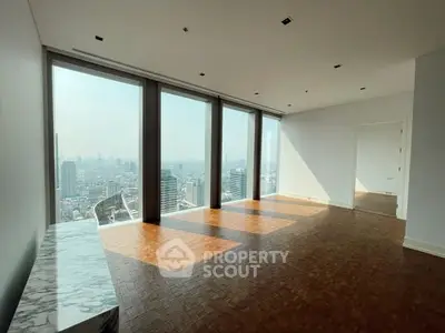 Spacious high-rise apartment with stunning city view and elegant parquet flooring.