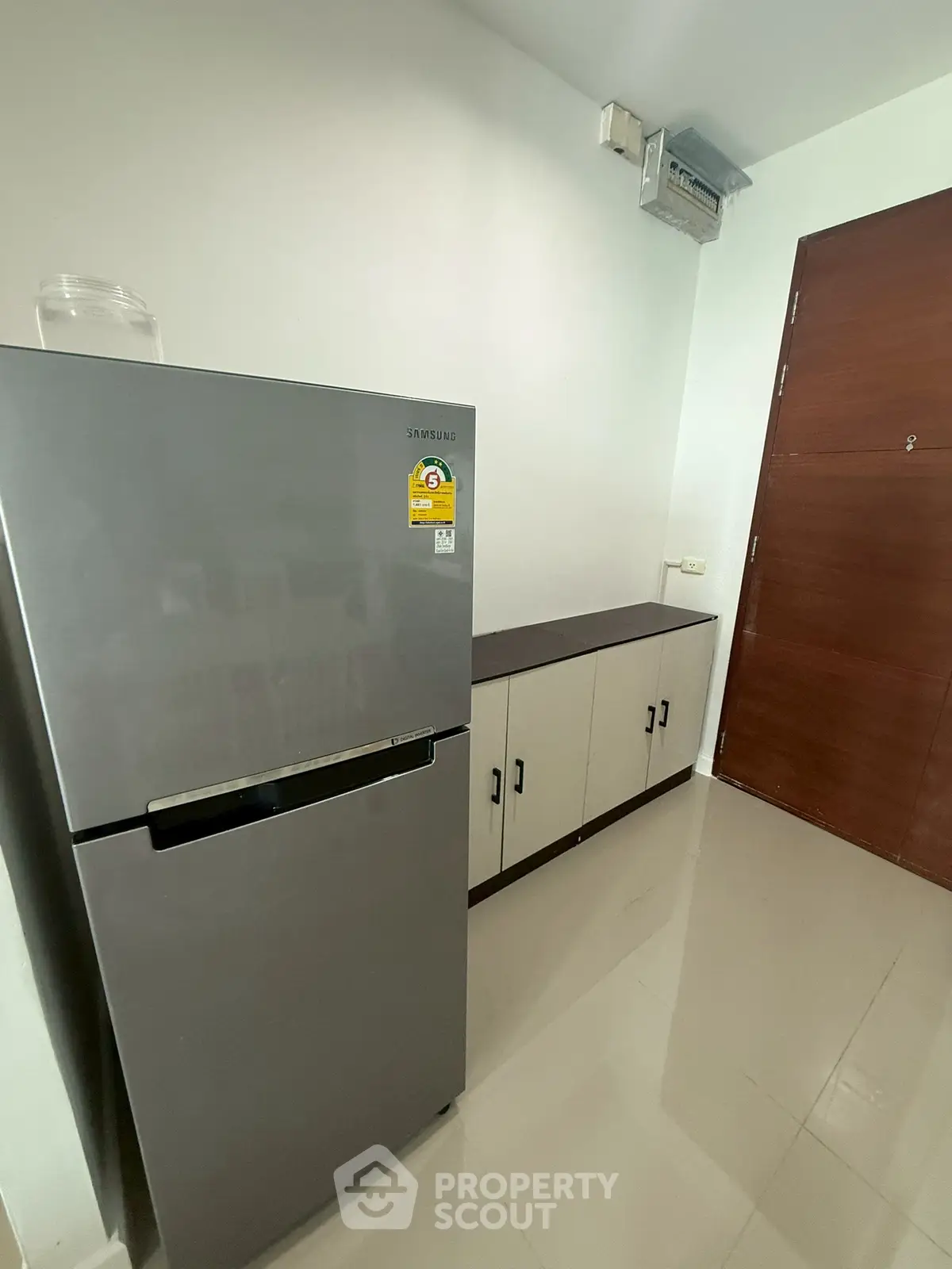 Modern kitchen with sleek refrigerator and ample storage cabinets
