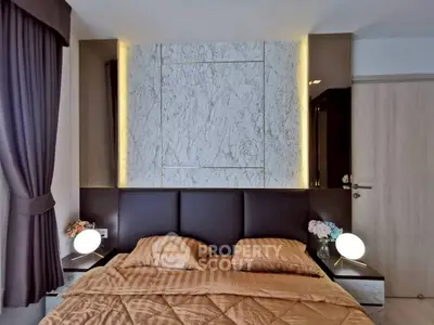 Luxurious bedroom with elegant marble accent wall and ambient lighting