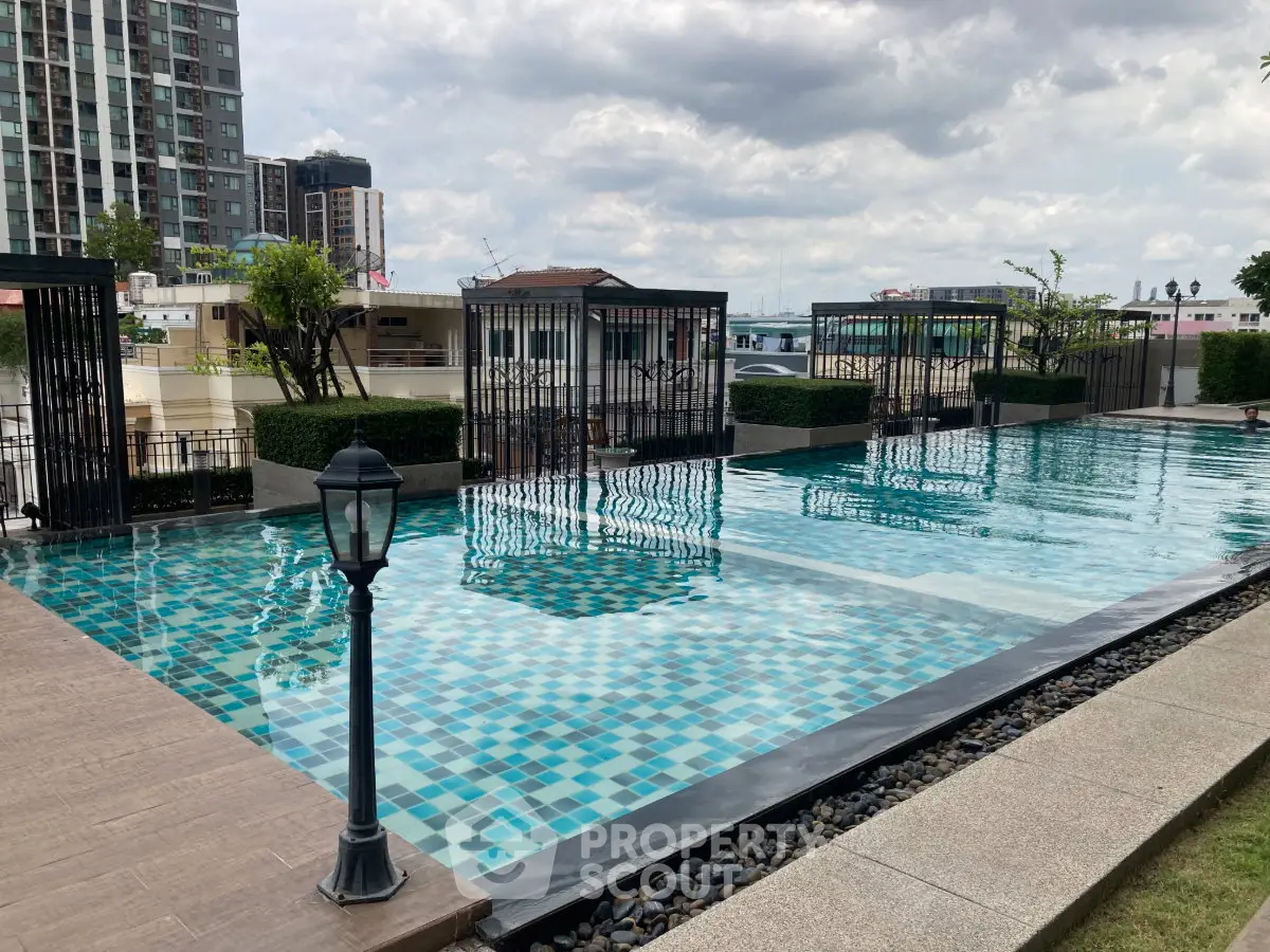 Luxurious rooftop pool with city views and modern design, perfect for relaxation and leisure.