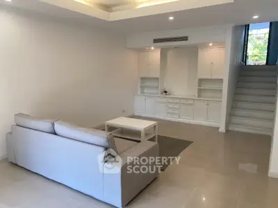 Spacious living room with modern sofa and built-in storage