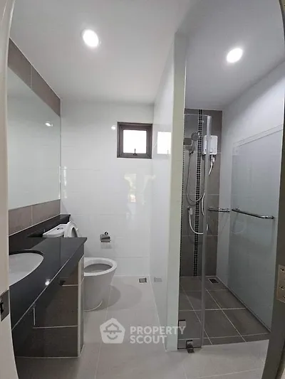Modern bathroom with sleek design and glass shower enclosure