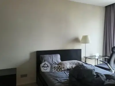 Modern bedroom with sleek furniture and natural lighting