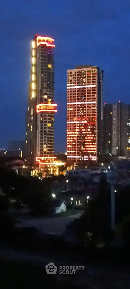 Stunning night view of illuminated skyscrapers in urban skyline