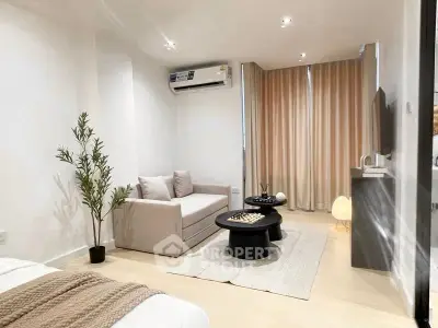 Modern living room with cozy sofa, air conditioning, and elegant decor.