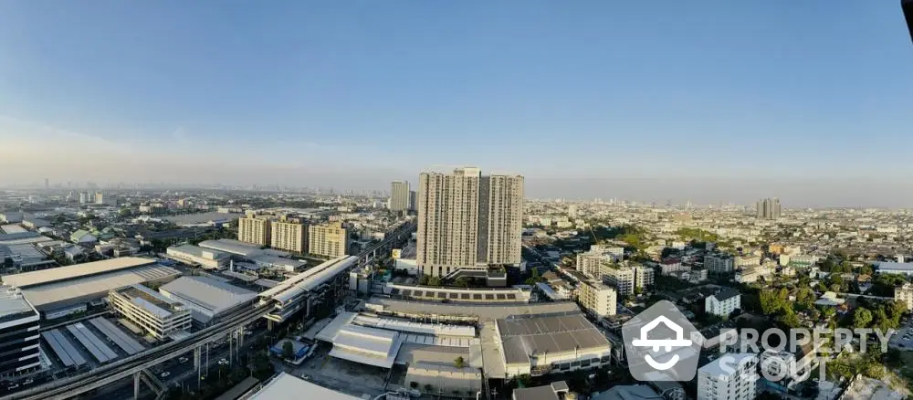 Panoramic cityscape view showcasing urban skyline and high-rise buildings.