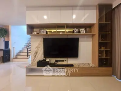 Modern living room with sleek TV unit and elegant decor