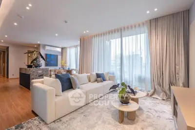 Luxurious modern living room with elegant decor and large windows