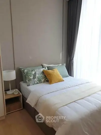 Cozy bedroom with modern decor and natural light