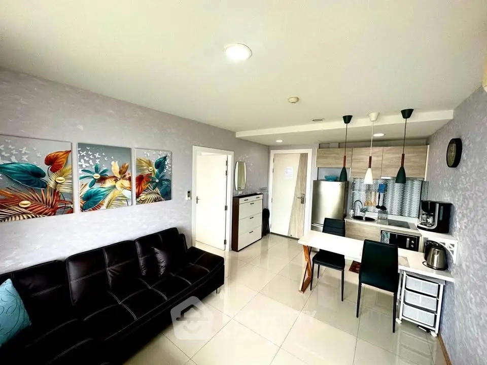 Modern open-layout living room with sleek kitchen and stylish decor