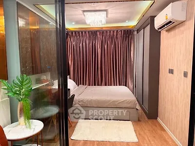 Modern bedroom with elegant decor and air conditioning in a cozy apartment.