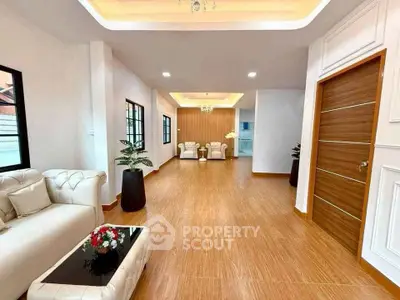 Spacious modern living room with elegant decor and wooden flooring