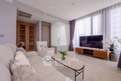Spacious modern living room with large windows and elegant decor