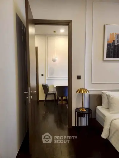 Modern apartment interior with stylish decor and dark wood flooring