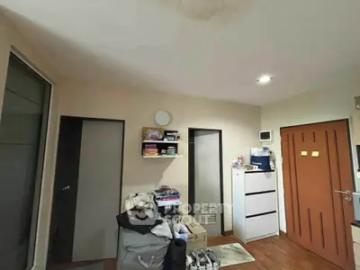 Cozy bedroom with modern storage solutions and wooden flooring