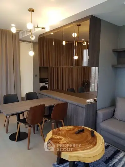 Modern living room with stylish dining area and unique wooden table
