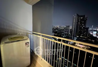 City view balcony with washing machine and night skyline