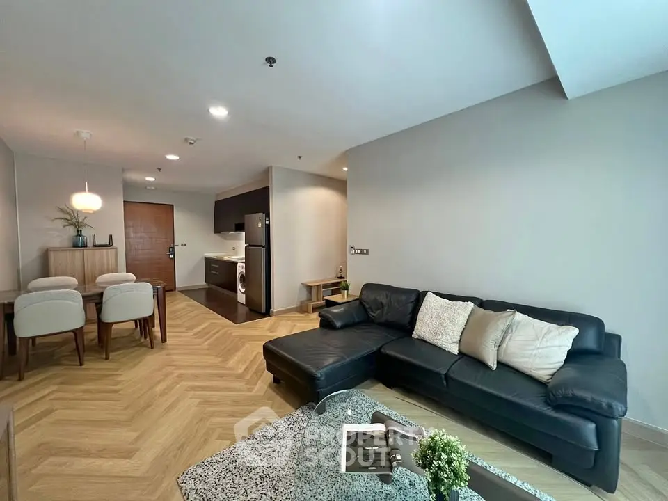 Spacious modern living room with stylish decor and open kitchen layout