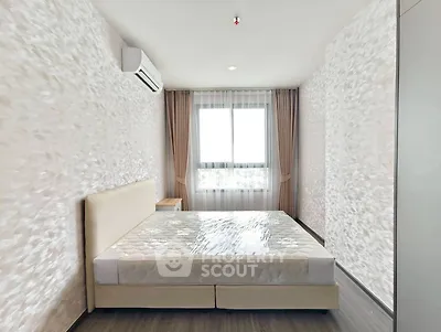 Modern bedroom with stylish decor and natural light