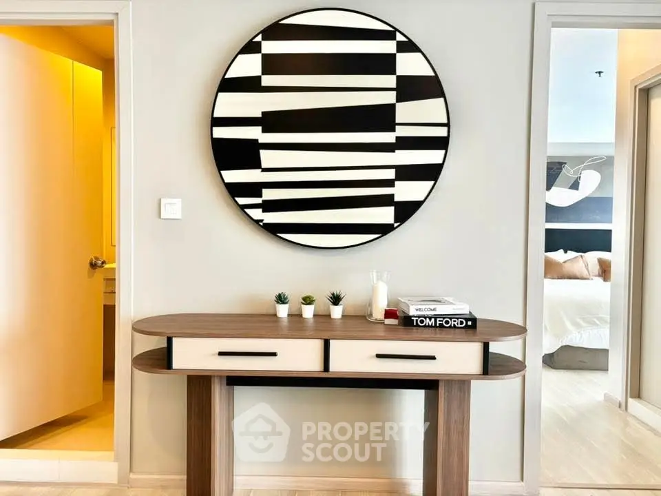 Stylish modern hallway with unique wall art and elegant console table.