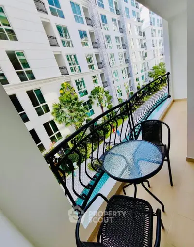 Charming balcony with elegant railing and city view in modern apartment complex.