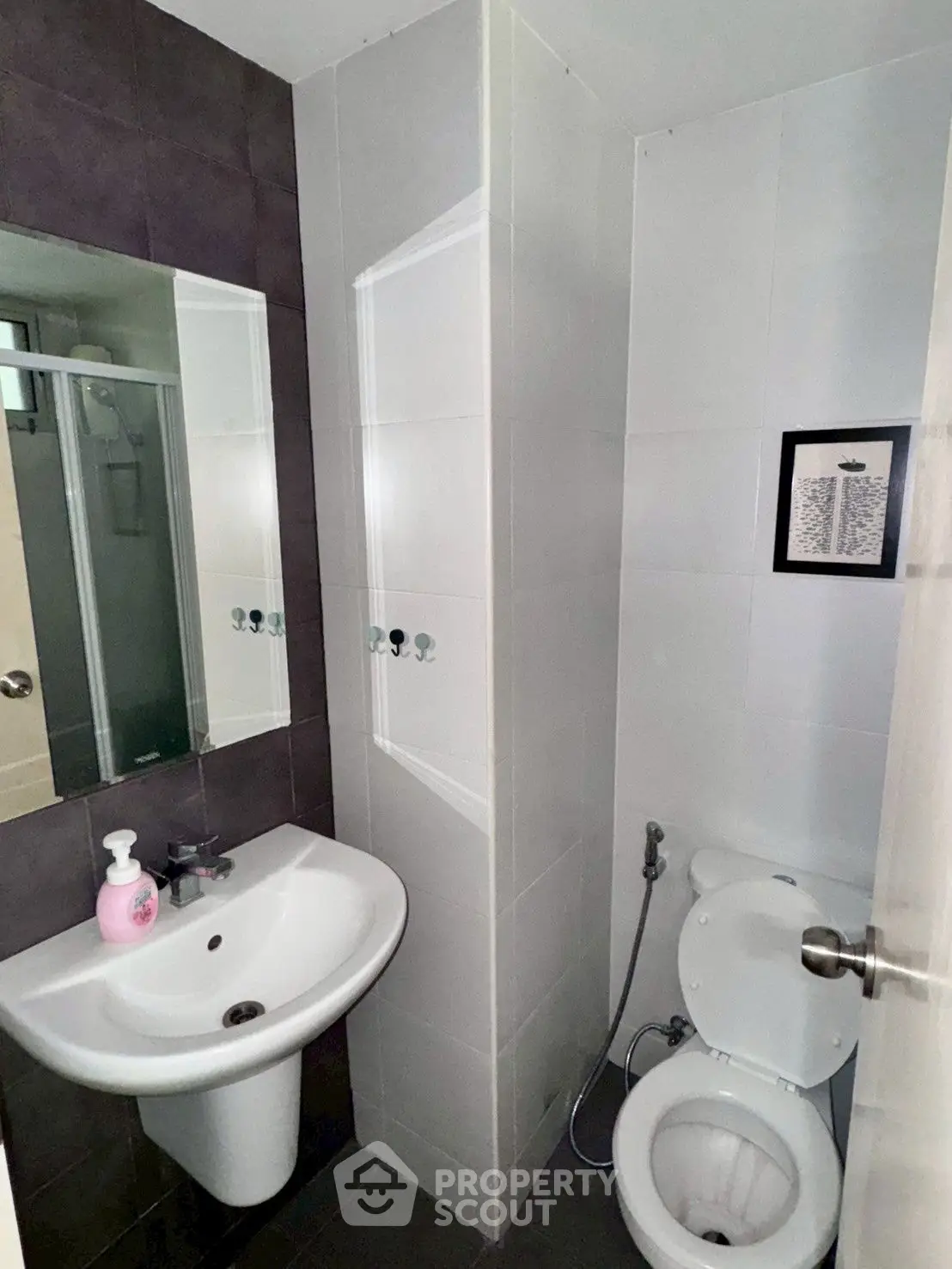 Compact modern bathroom with sleek fixtures and minimalist design