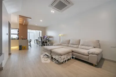 Spacious modern living room with cozy sectional sofa and open layout