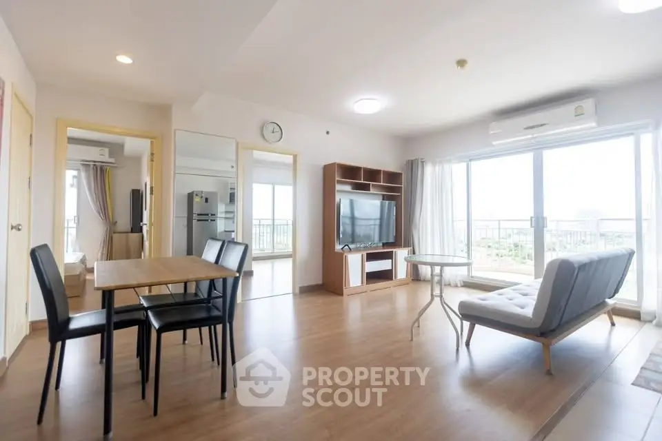 Spacious modern living room with large windows and stylish furniture