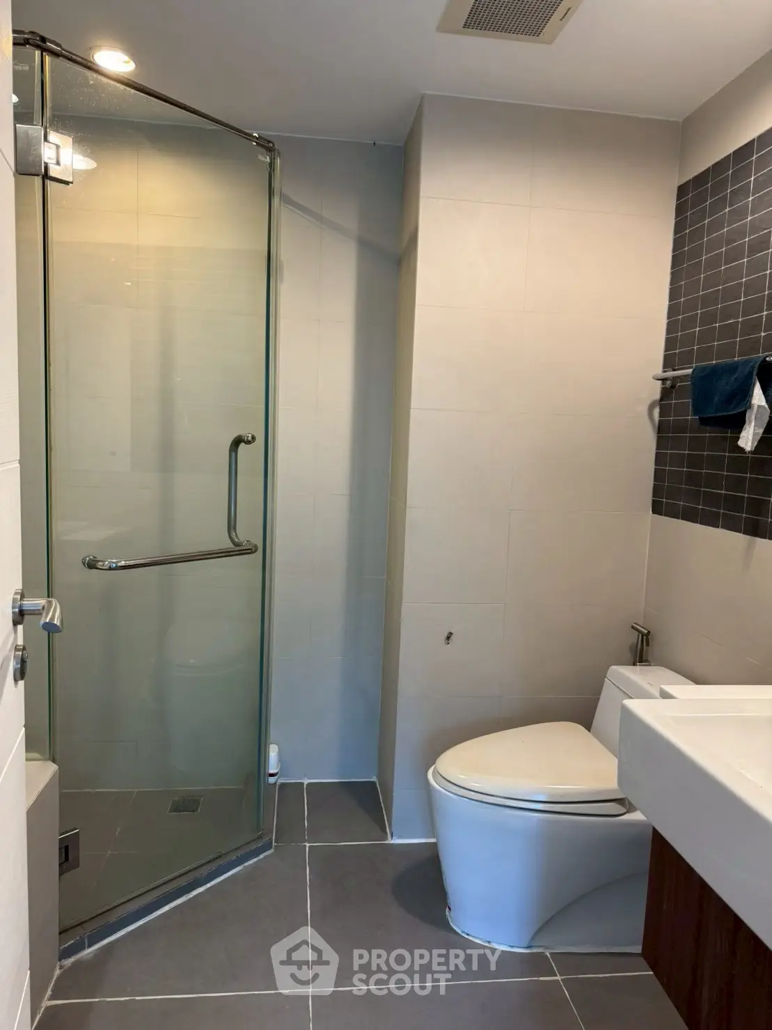 Modern bathroom with glass shower and sleek fixtures