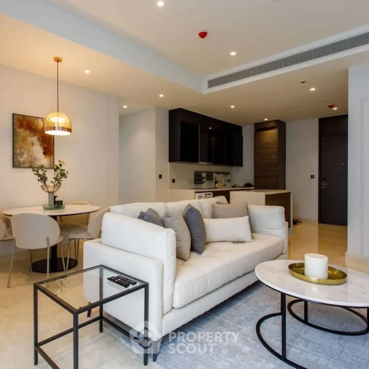 Modern open-plan living room with elegant decor and cozy seating area