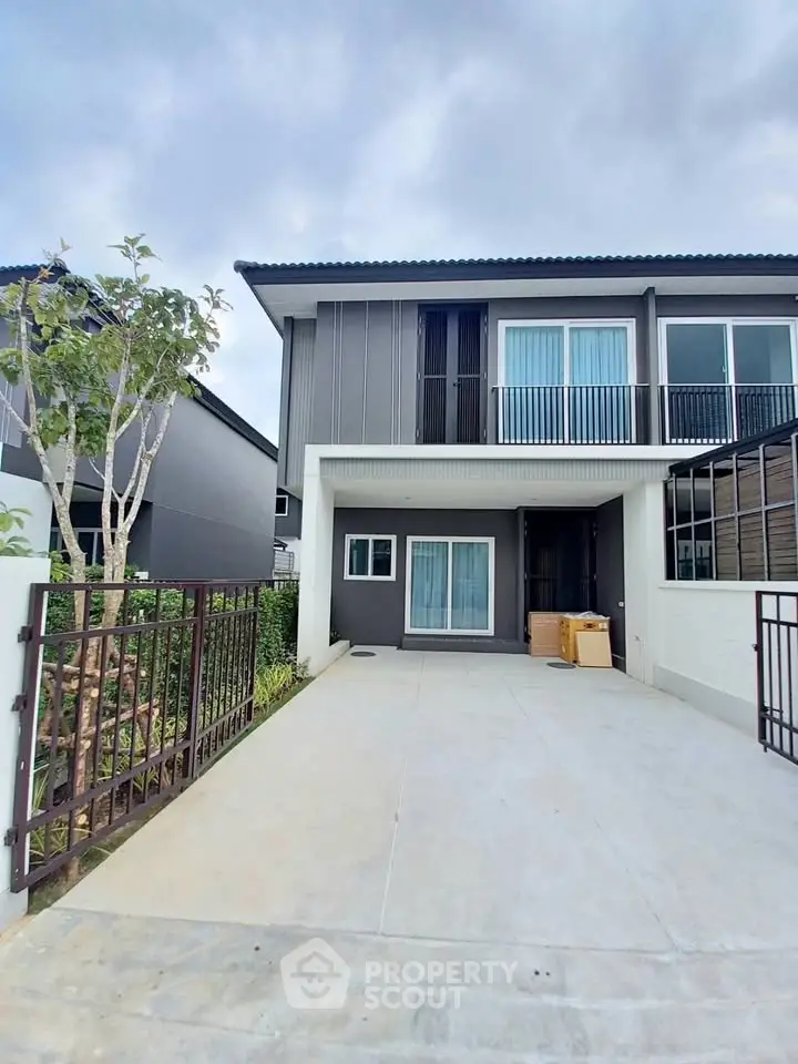 Modern two-story house with sleek design and spacious driveway