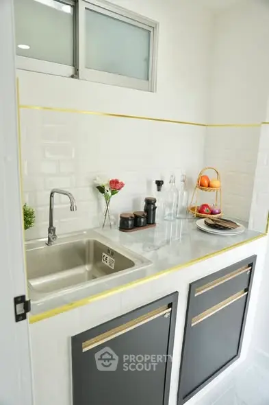 Modern kitchen with sleek design and stainless steel sink