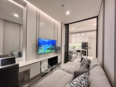 Modern living room with sleek design and open kitchen layout