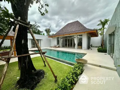 Luxurious villa with private pool and lush garden, featuring modern architecture and serene outdoor space.