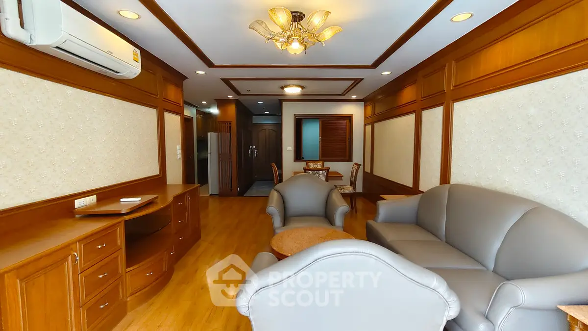 Elegant living room with classic wood paneling and cozy seating area