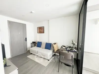 Modern living room with stylish decor and cozy seating area in a contemporary apartment.