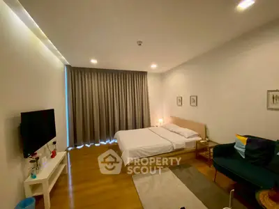Spacious bedroom with modern decor and cozy ambiance