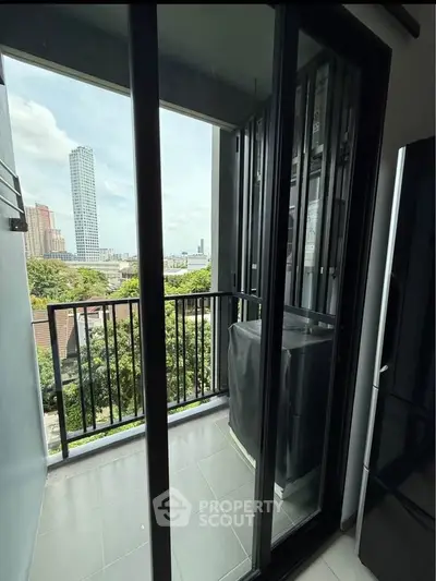 Chic urban balcony with city view, perfect for relaxation and enjoying the skyline.