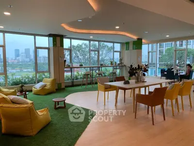 Spacious modern living room with panoramic city views and stylish furniture